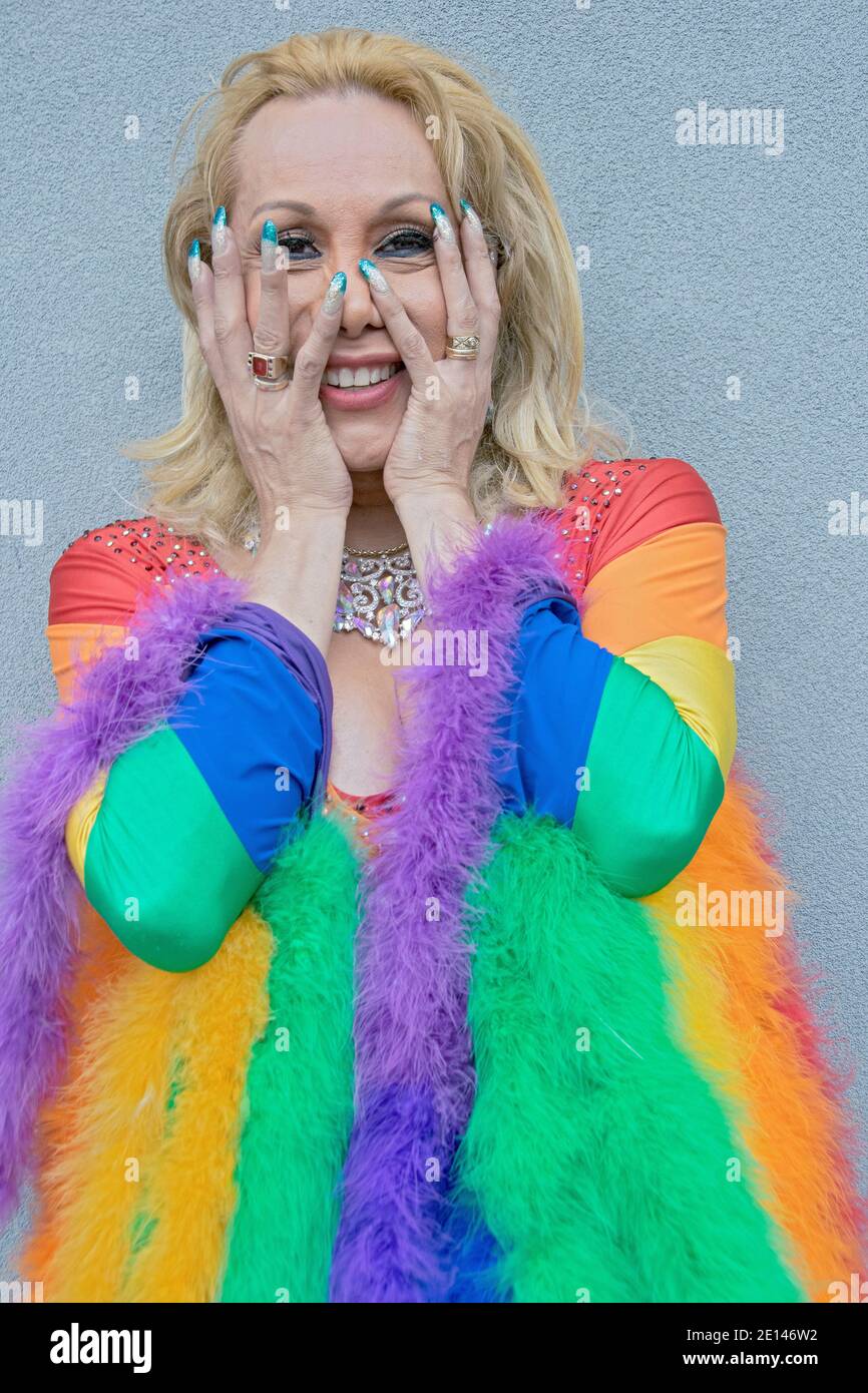 A transgender woman in a very colorful rainbow outfit at the Queens Pride Parade in Jackson Heights Queens, New York. Stock Photo