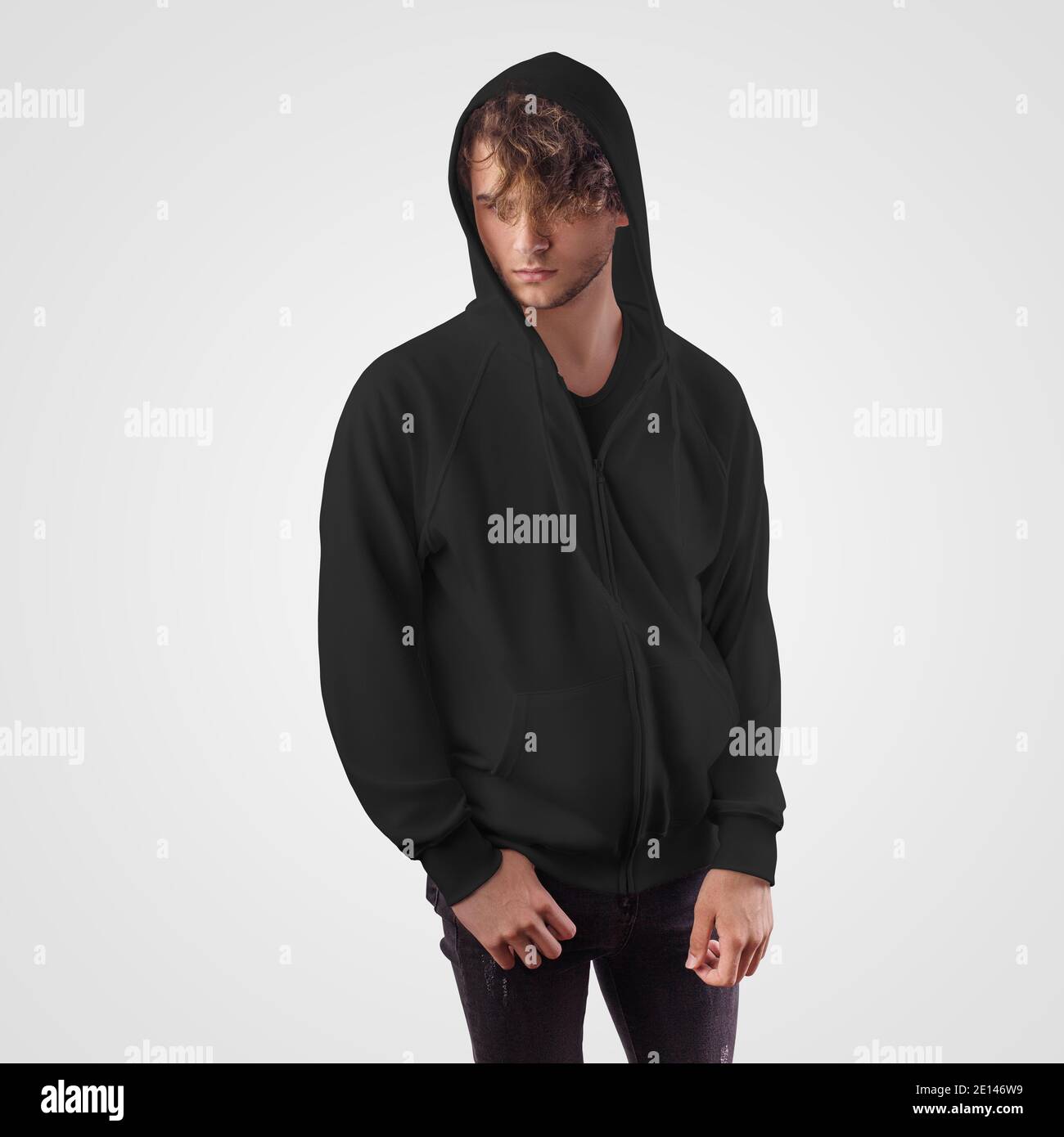 A mockup of a black hoodie on a guy in a hood, a sweatshirt with a pocket, a zipper, for advertising, print. Sweatshirt pattern isolated on background Stock Photo