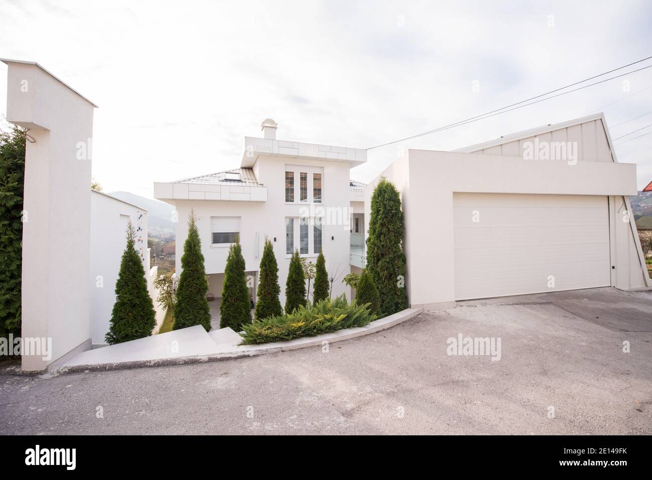 Contemporary beautiful modern white house exterior Stock Photo - Alamy