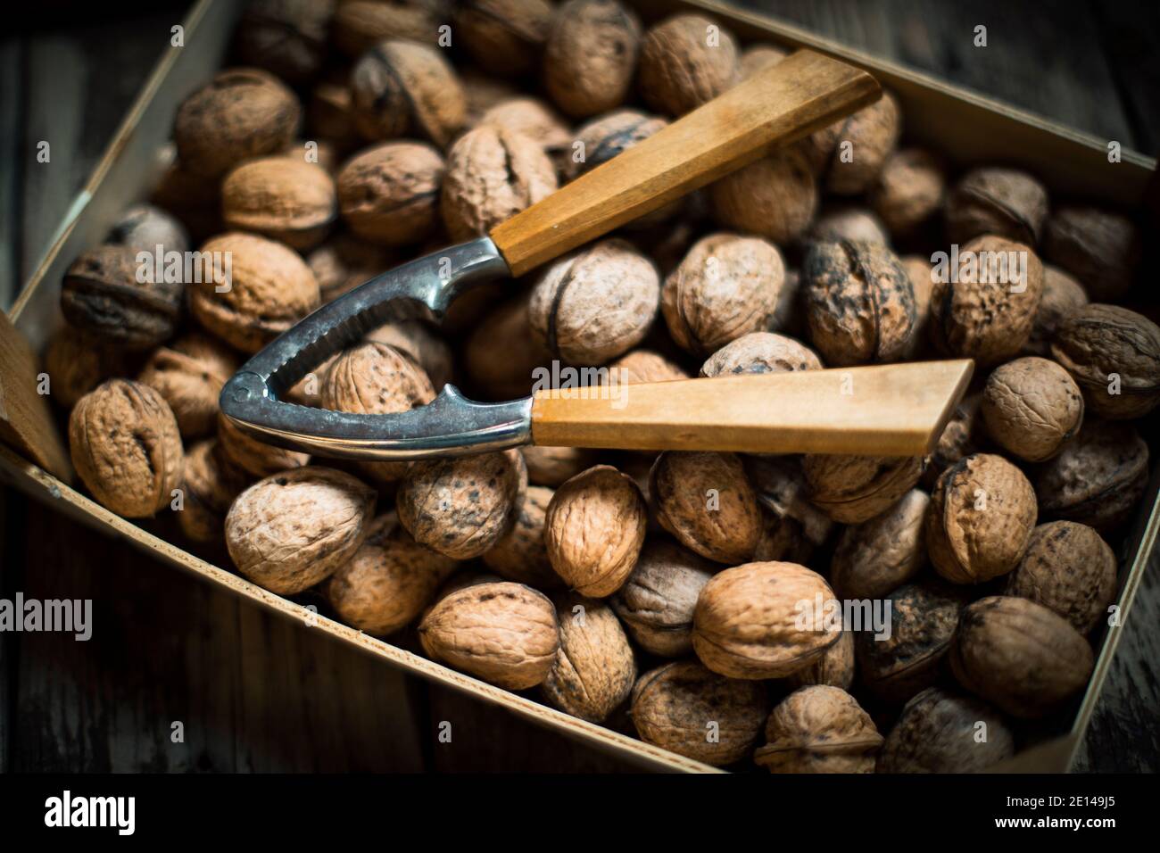 Close-up From Walnuts In A Box With A Nutcracker Stock Photo