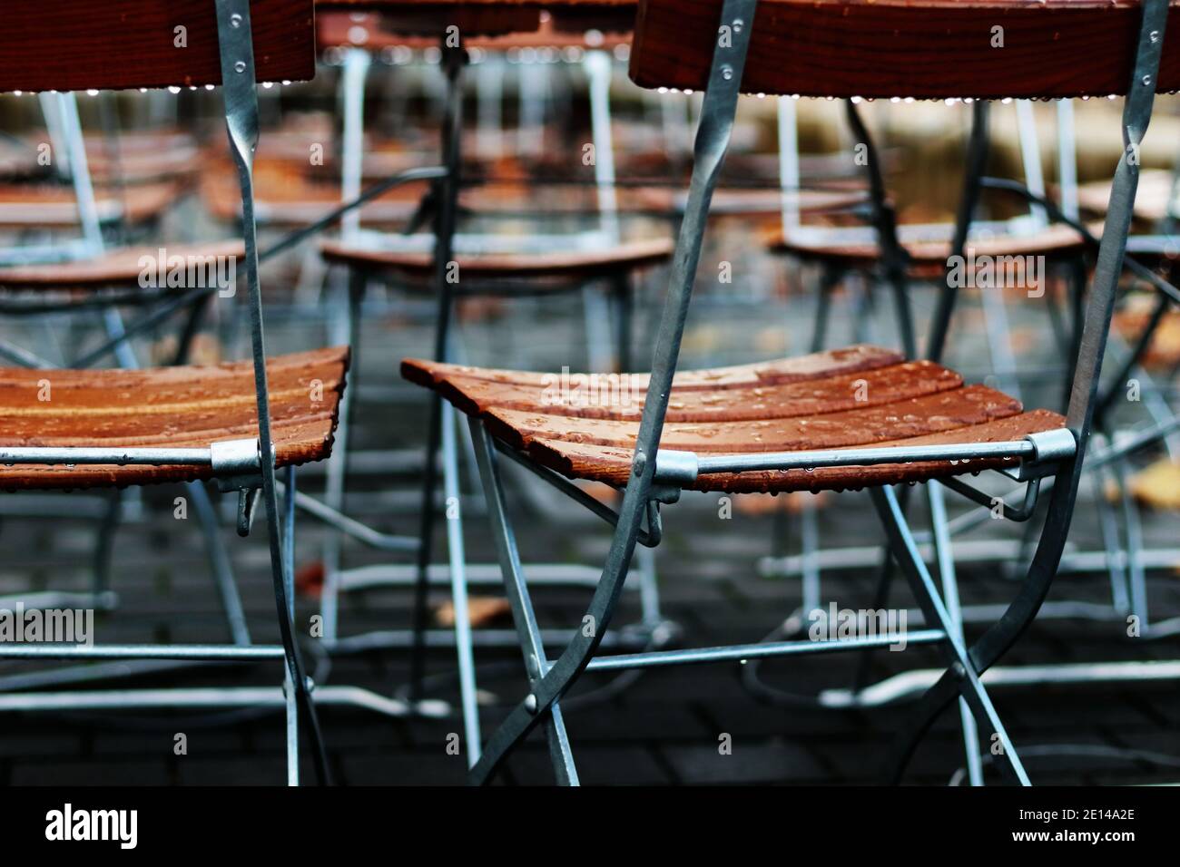 Chairs In Rain Stock Photo Alamy