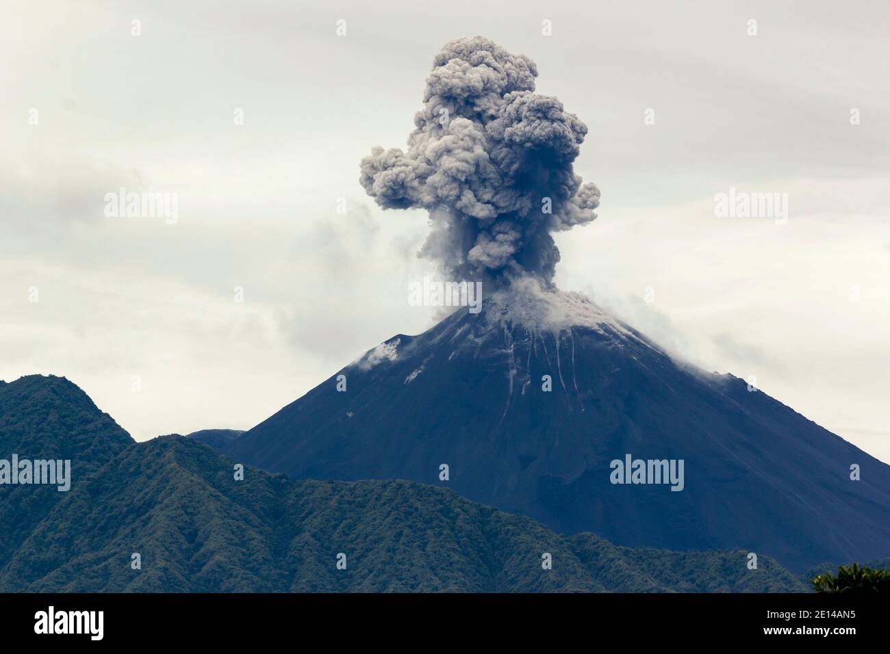 Reventador Volcano erupting, November 2015. Situated in a remote region of the Ecuadorian Amazon, Reventador has been erupting since 2002. Stock Photo