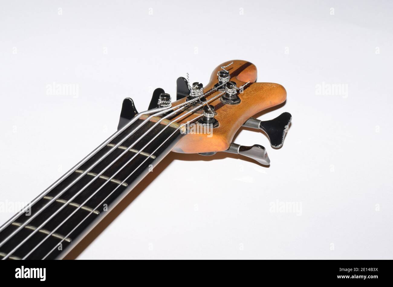 bass guitar with five strings on white background Stock Photo