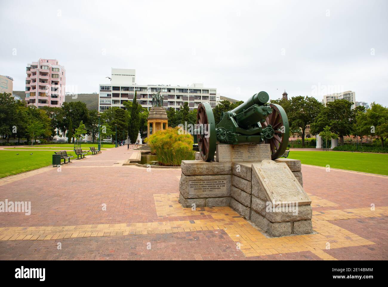 Gardens-  Cape Town, South Africa - 23/11/2020 Green canon statue, standing in Gardens. Surrounded by vibrant greenery and colorful buildings. Stock Photo