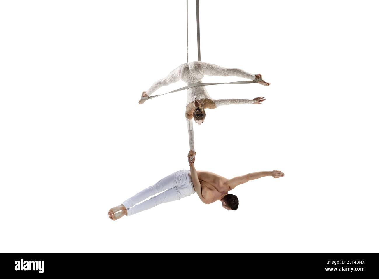 Together. Couple of acrobats, circus athletes isolated on white studio