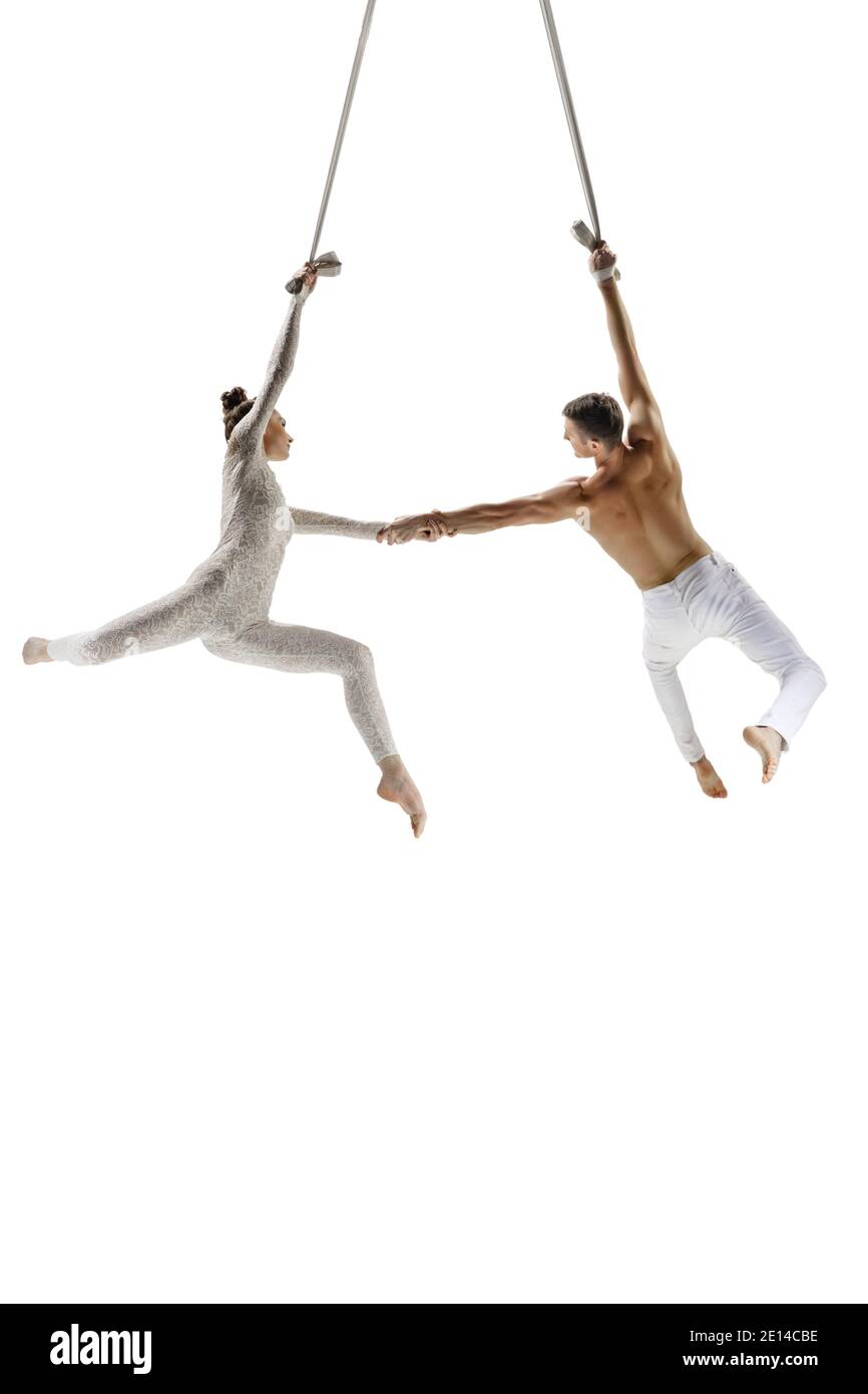 Dance. Couple of acrobats, circus athletes isolated on white studio