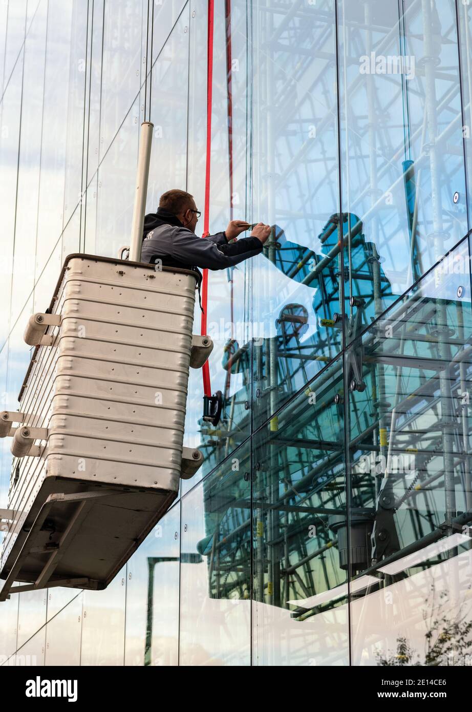 Craftsmen Repair The Pane At An Office Building Stock Photo