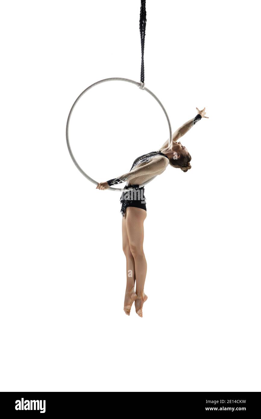 Inspiration. Young female acrobat, circus athlete isolated on white ...