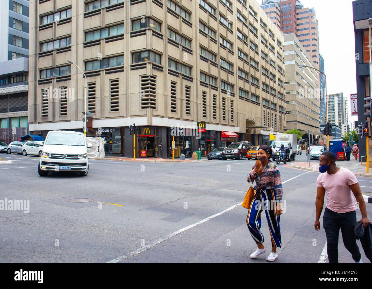 Cape Town, South Africa - 23/11/2020 Cloudy day in the Mother City. People in face masks, walking by. Stock Photo