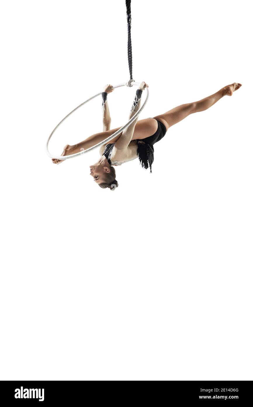 Target. Young female acrobat, circus athlete isolated on white studio ...