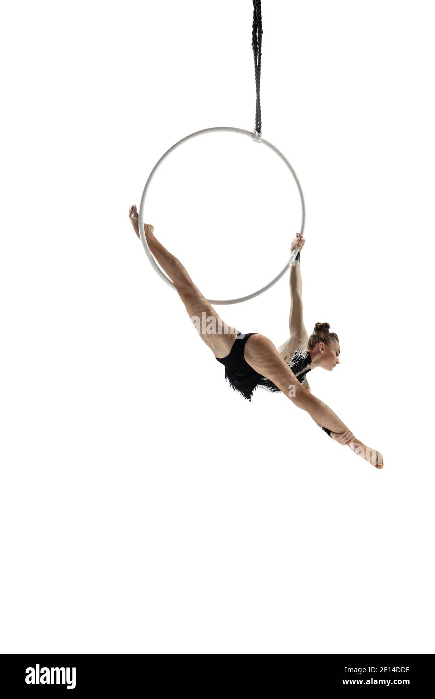 Spring bird. Young female acrobat, circus athlete isolated on white