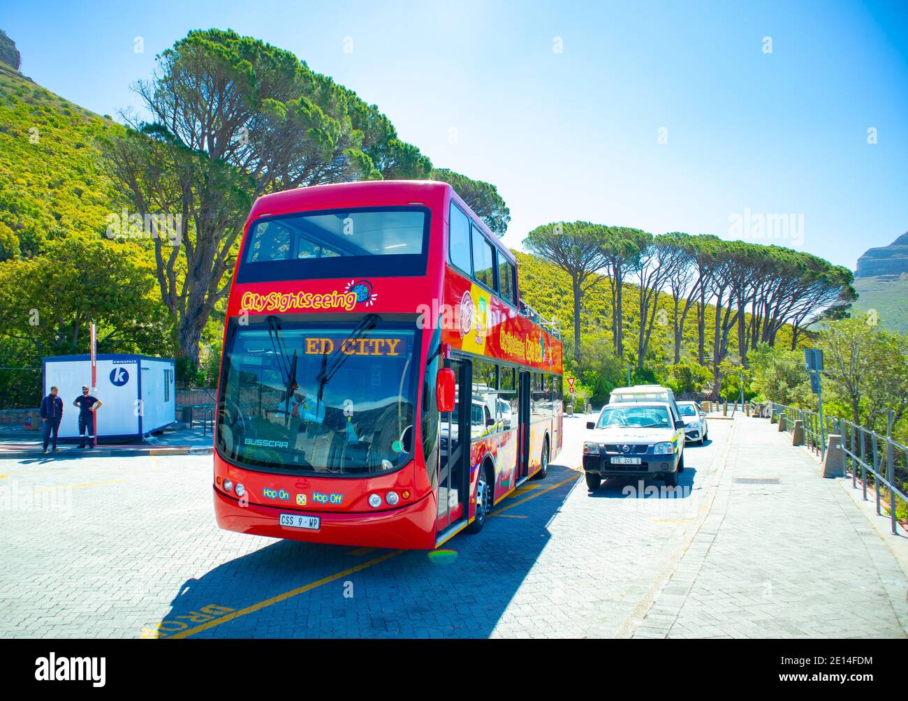 Kloof Corner - Cape Town, South Africa -  02/12/2020 City Sight Seeing bus pulling up at the Cable Car area. Lush greenery in background. Stock Photo