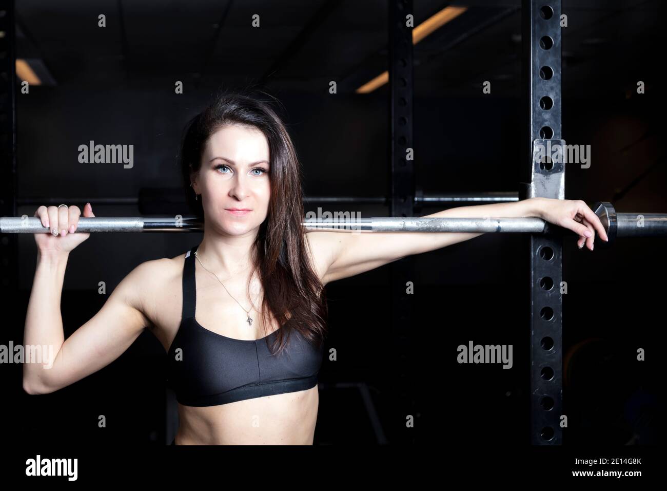 In the gym a brunette in sportswear. She poses Photo after filter  processing. High quality photo Stock Photo - Alamy