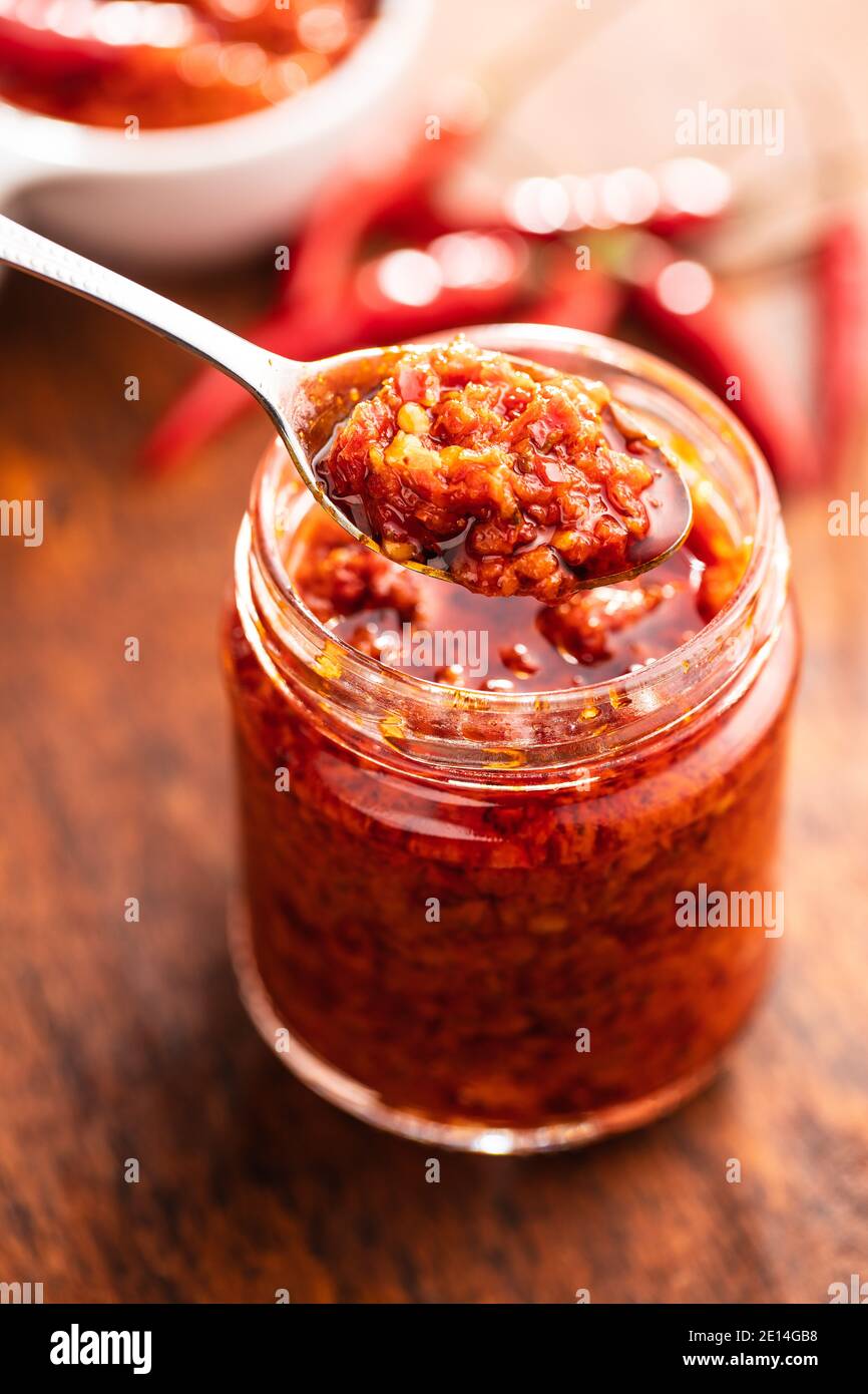Red hot chili paste on spoon Stock Photo Alamy