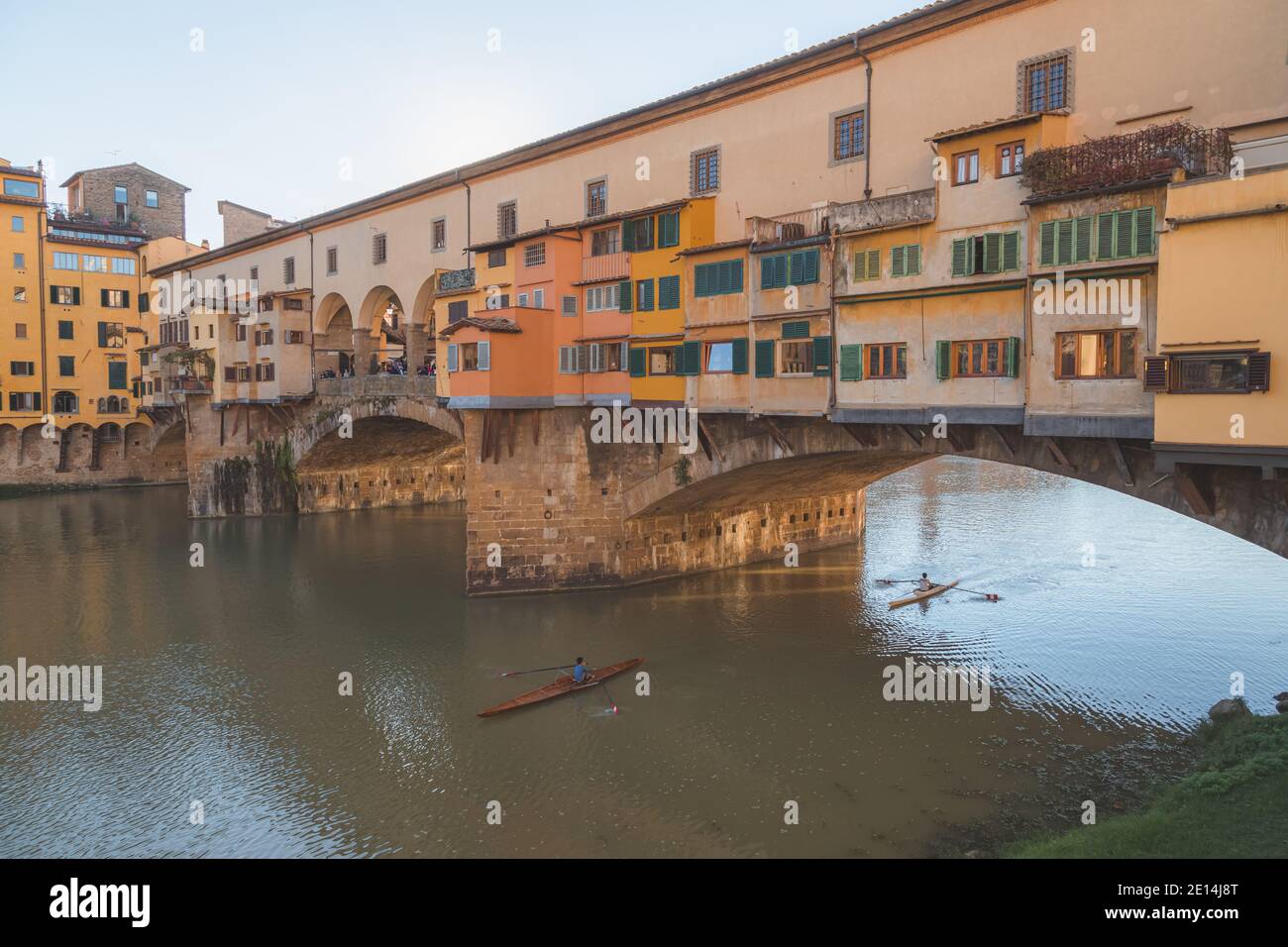 Longboat rowers under the iconic Ponte Vecchio over the River Arno in ...