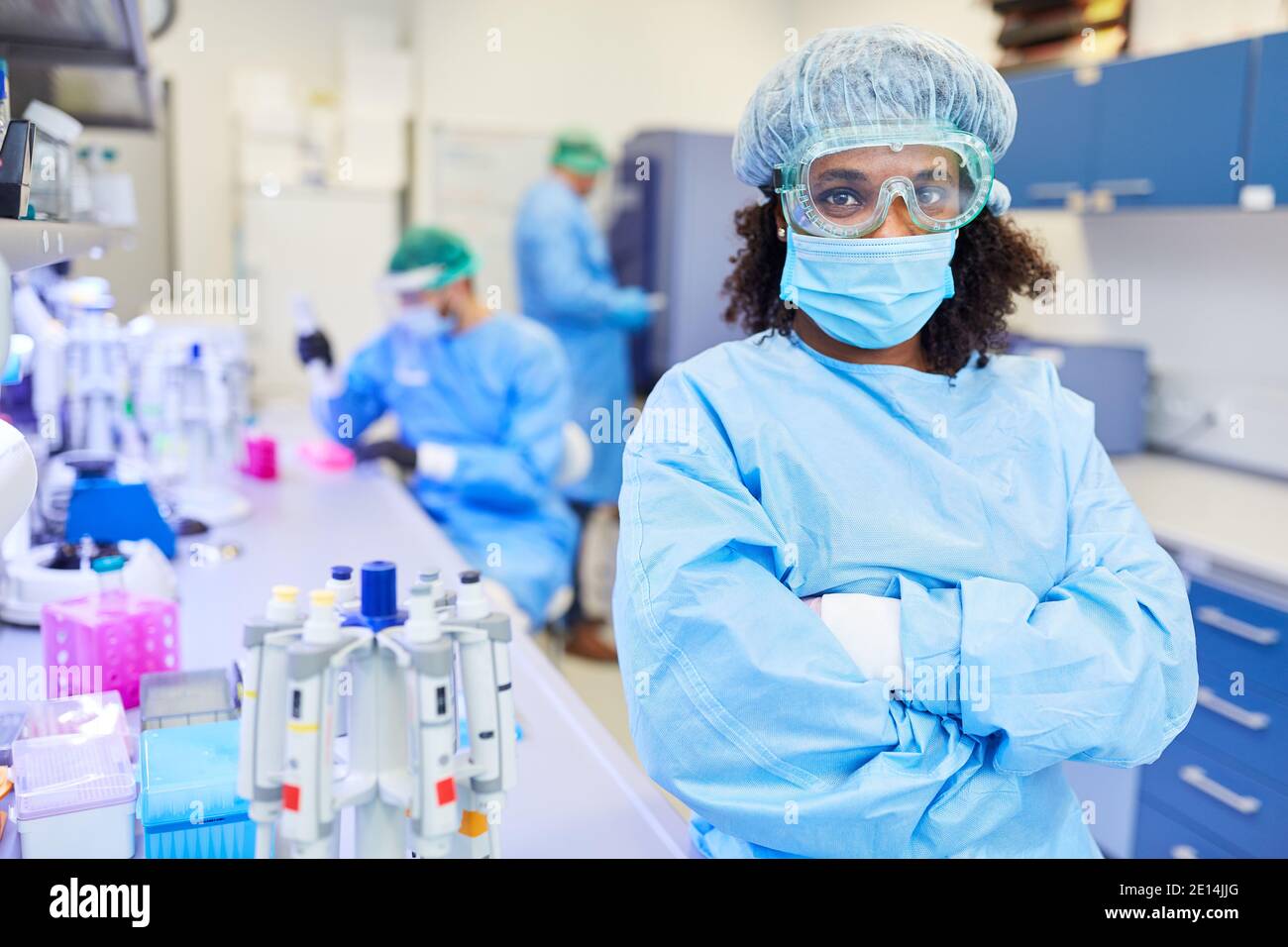African woman works with team in the laboratory for research against Covid-19 and coronavirus Stock Photo