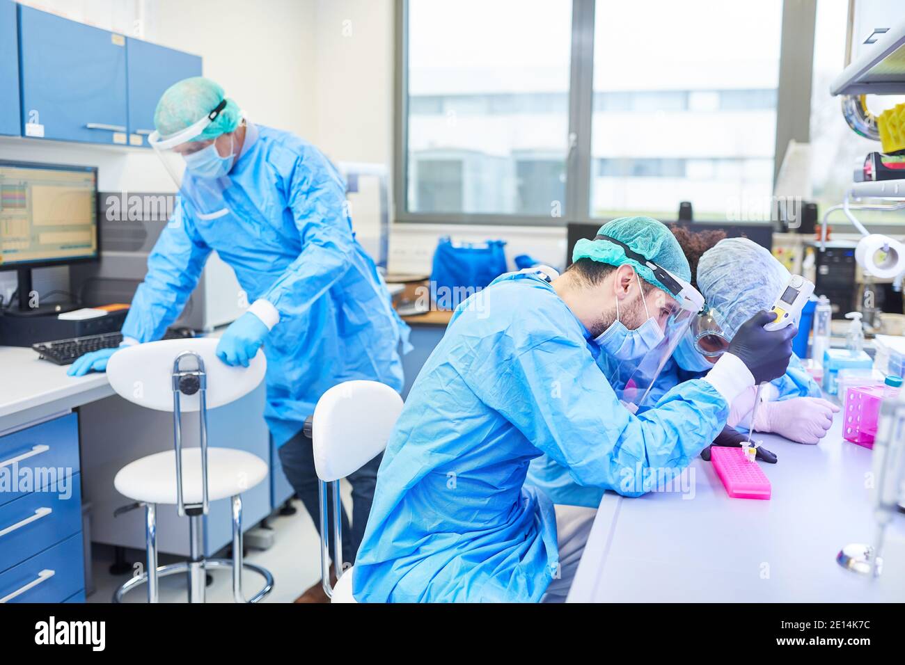 Group scientists research in the laboratory on Covid-19 vaccine for coronavirus pandemic Stock Photo