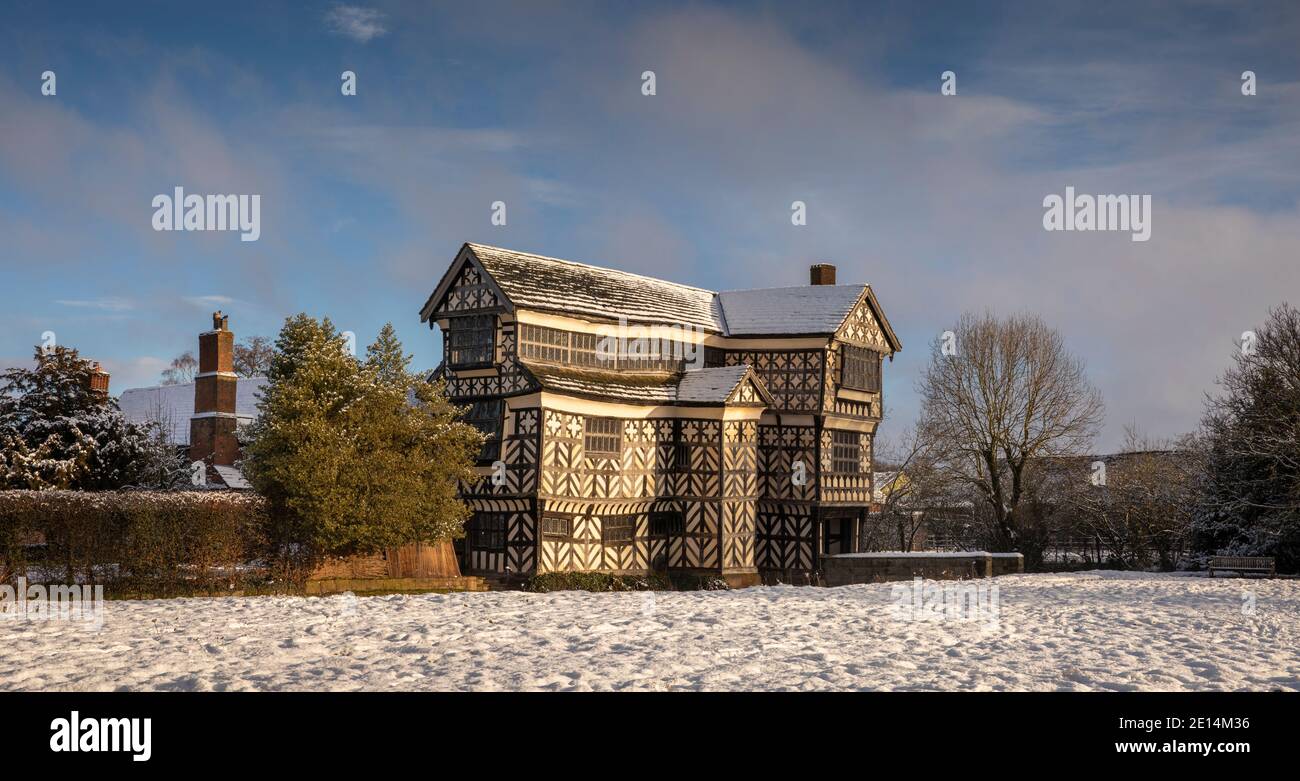 UK, England, Cheshire, Scholar Green, Little Moreton Hall, timber-framed Tudor Farmhouse, in winter, panoramic Stock Photo