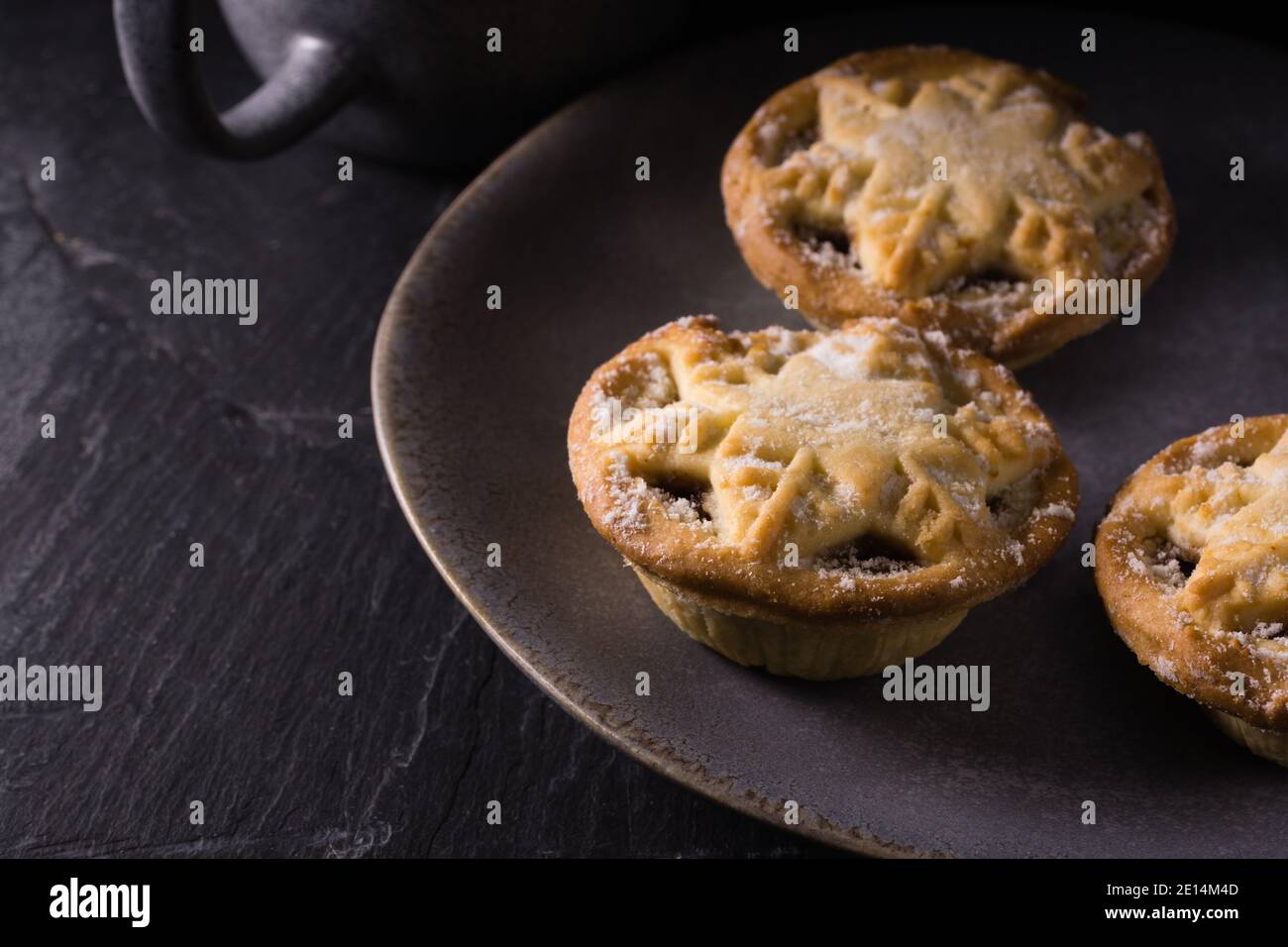 Traditional mince pies filled with a mix of dried fruits and spices called mincemeat and traditionally served at Christmas Stock Photo