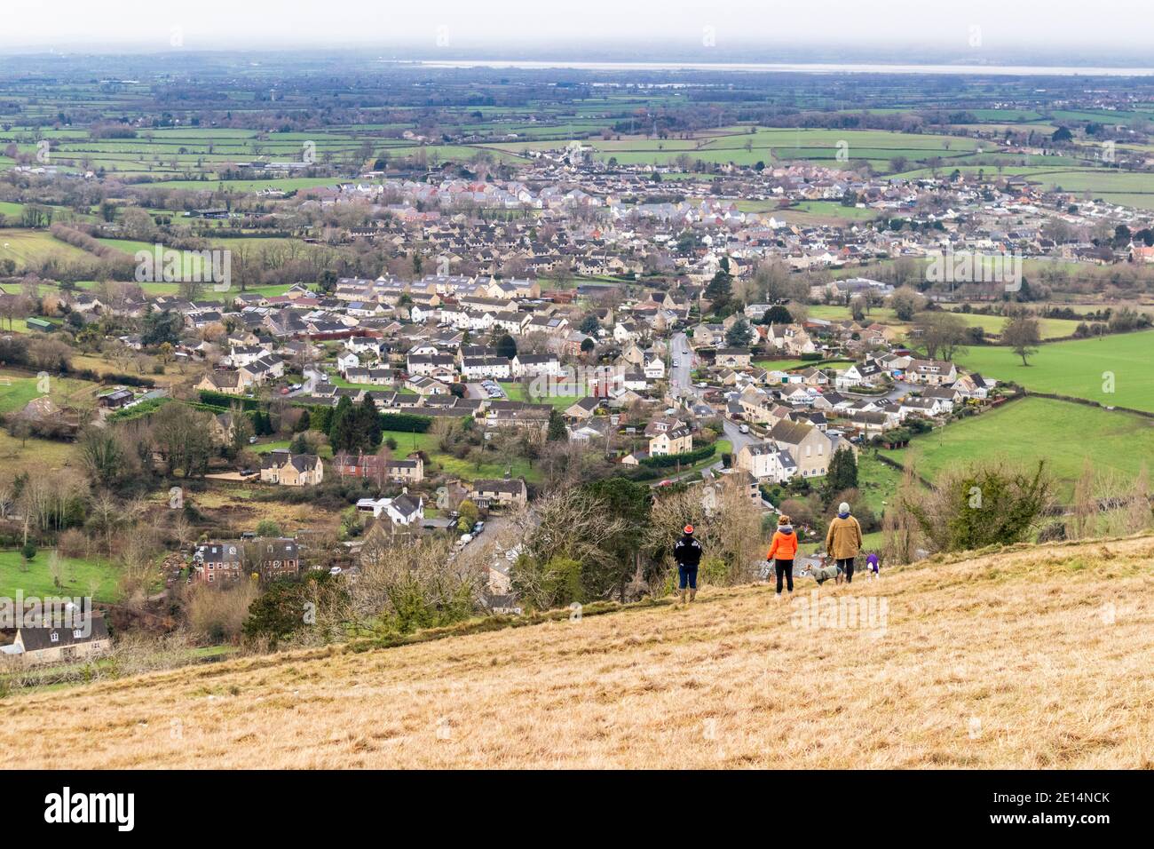 Walkers on Selsley Common enjoying the winter view towards the River Severn across Middleyard and Kings Stanley, Gloucestershire UK Stock Photo