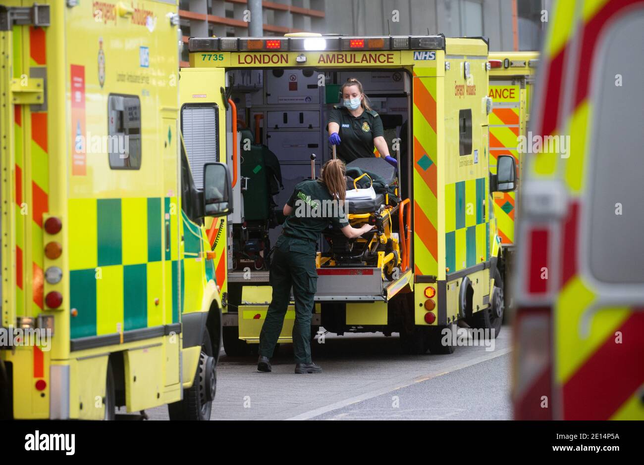 London, UK. 4th Jan, 2020. Medical equipment is loaded into an ambulance. Lines of Ambulances outside the Royal London hospital as the NHS is under severe pressure as the cases of Covid-19 increase. Over 58,000 cases werte reported today. Boris Johnson expects 'tens of Millions' of Covid jabs to happen by April. Credit: Mark Thomas/Alamy Live News Stock Photo