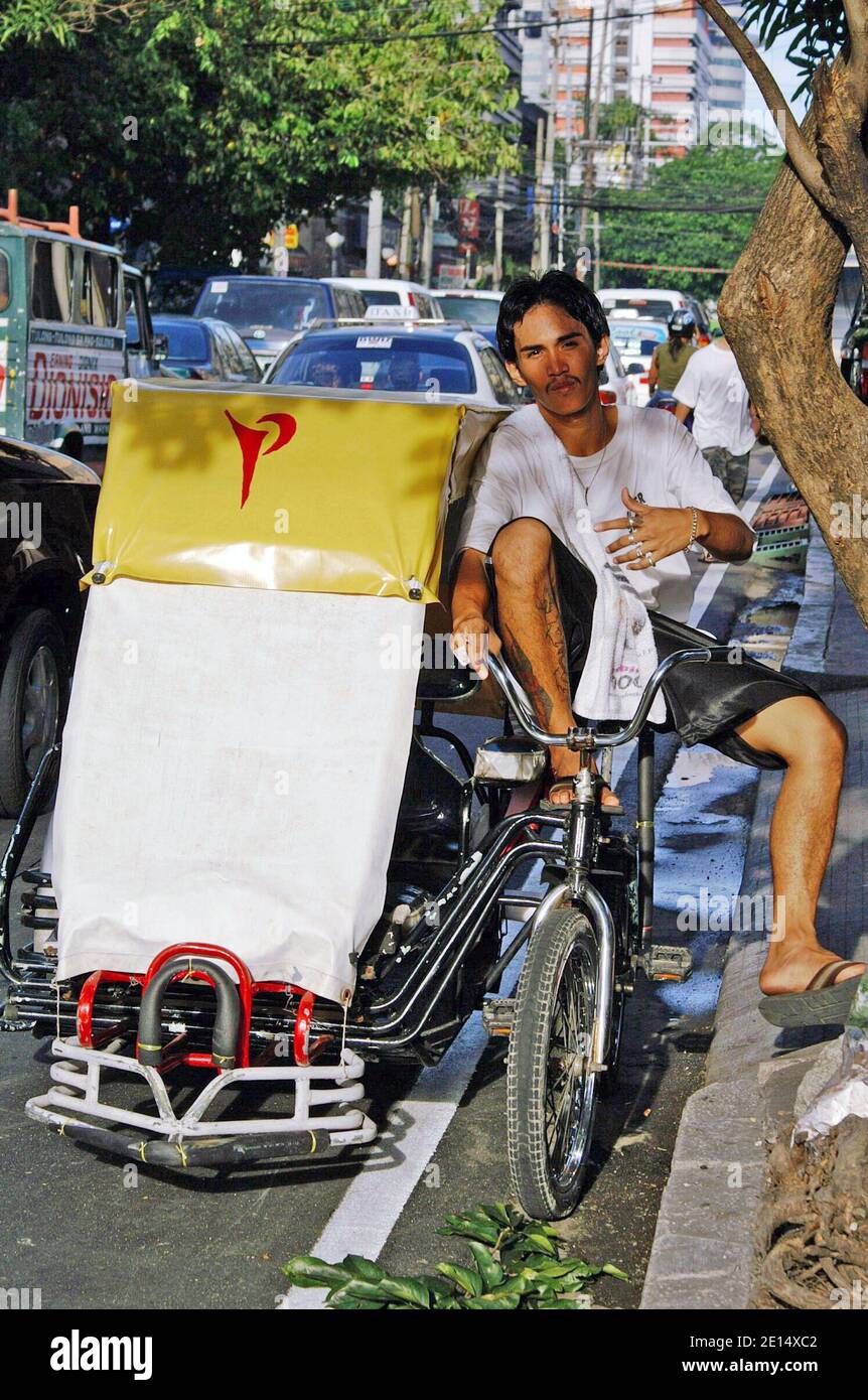 Filipino man with pedicab hi-res stock photography and images - Alamy