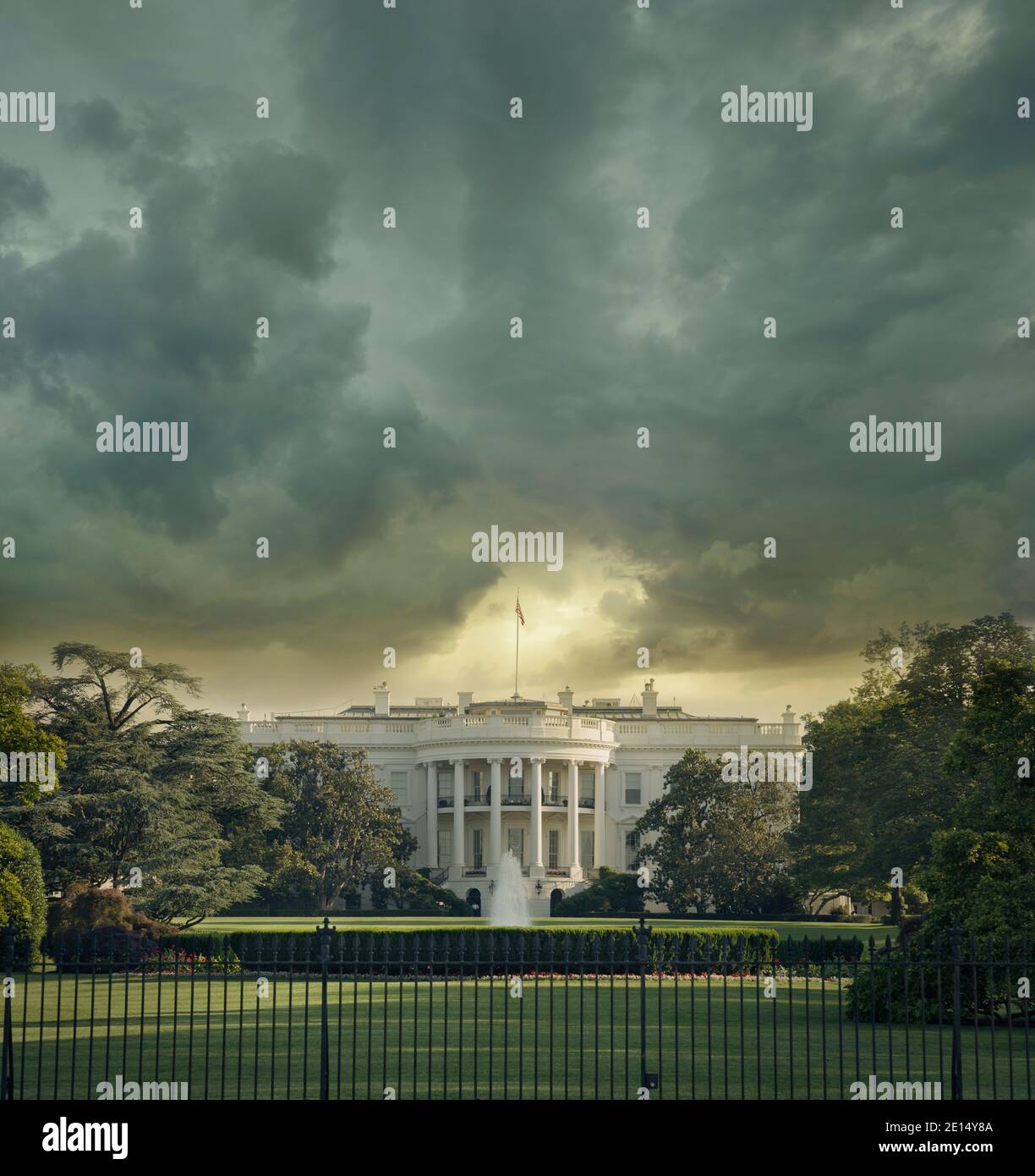 The White House in Washington DC under dark stormy clouds Stock Photo