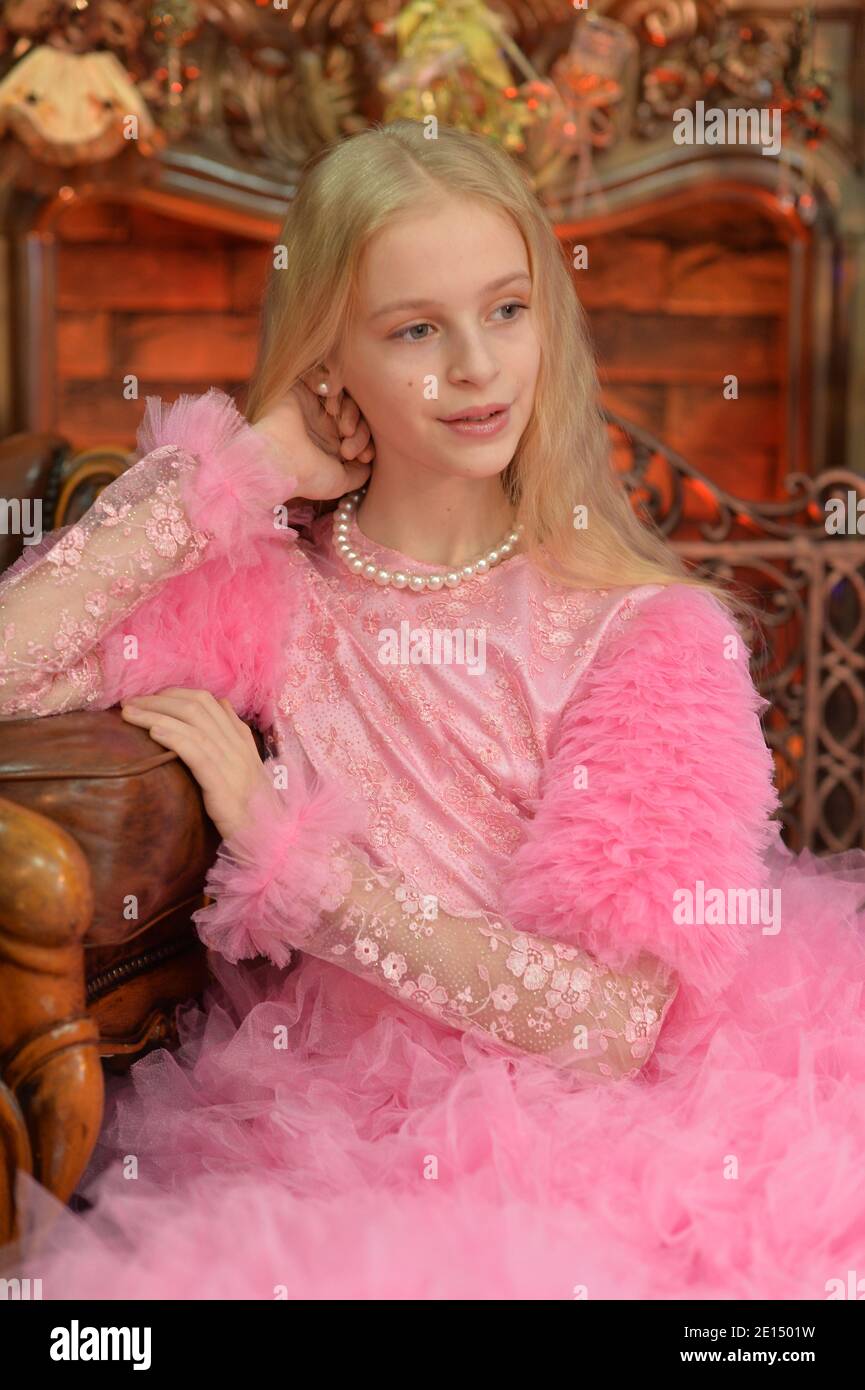 Portrait of cute little girl posing in studio Stock Photo - Alamy