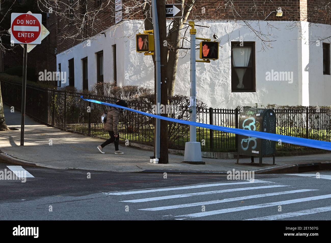 New York, USA. 04th Jan, 2021. Police tape seals off Justice Avenue behind as the NYPD investigate a bomb scare around a suspicious vehicle parked on the up-ramp of the Queens Place Mall shopping center's garage, in the Elmhurst section of the Queens borough of New York, NY, January 4, 2021. The Bomb scare, which was determined to be a hoax by the NYPD, prompted an evacuation of the area as police sealed off the block around the mall and shut down parts of Queens Boulevard. (Photo by Anthony Behar/Sipa USA) Credit: Sipa USA/Alamy Live News Stock Photo