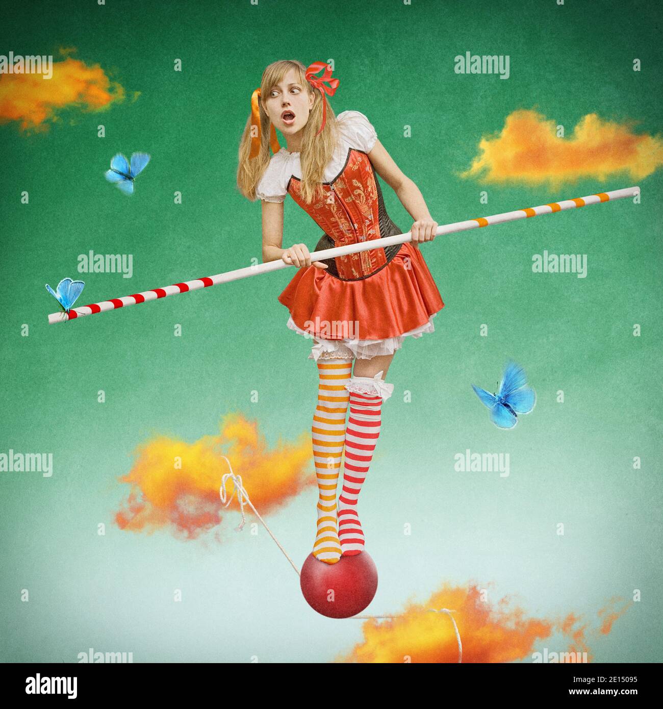 surreal fairy tale artwork, circus girl balancing on a rope in the sky, beautiful model and fantasy background Stock Photo