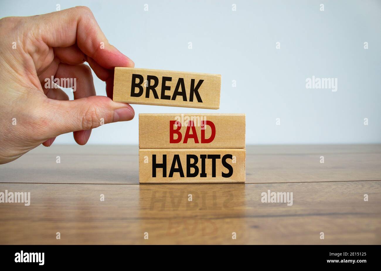 Break bad habits symbol. Wooden blocks with words 'break bad habits ...