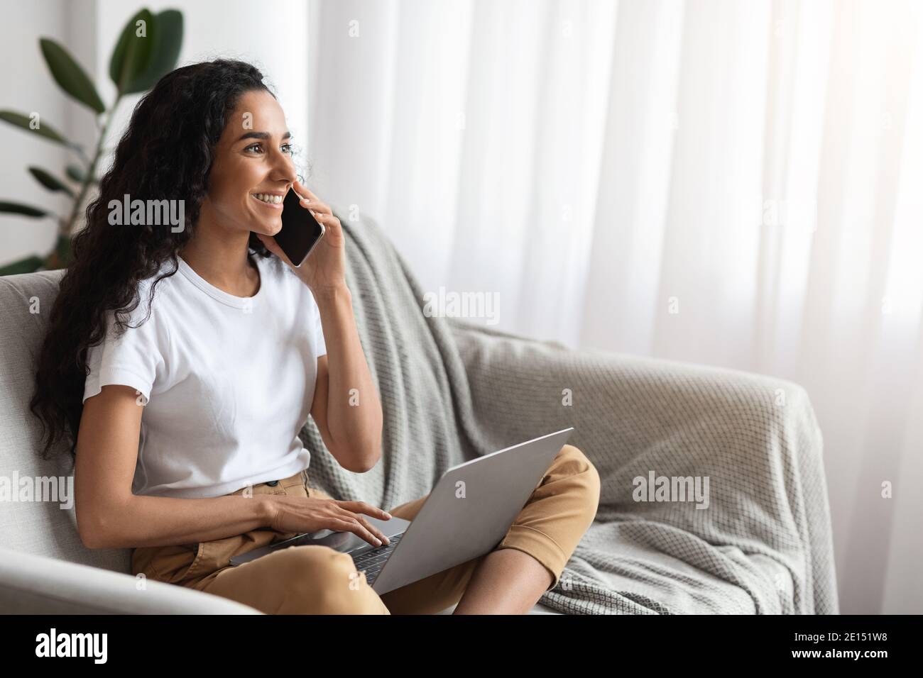Beautiful brunette woman enjoying weekend at home Stock Photo