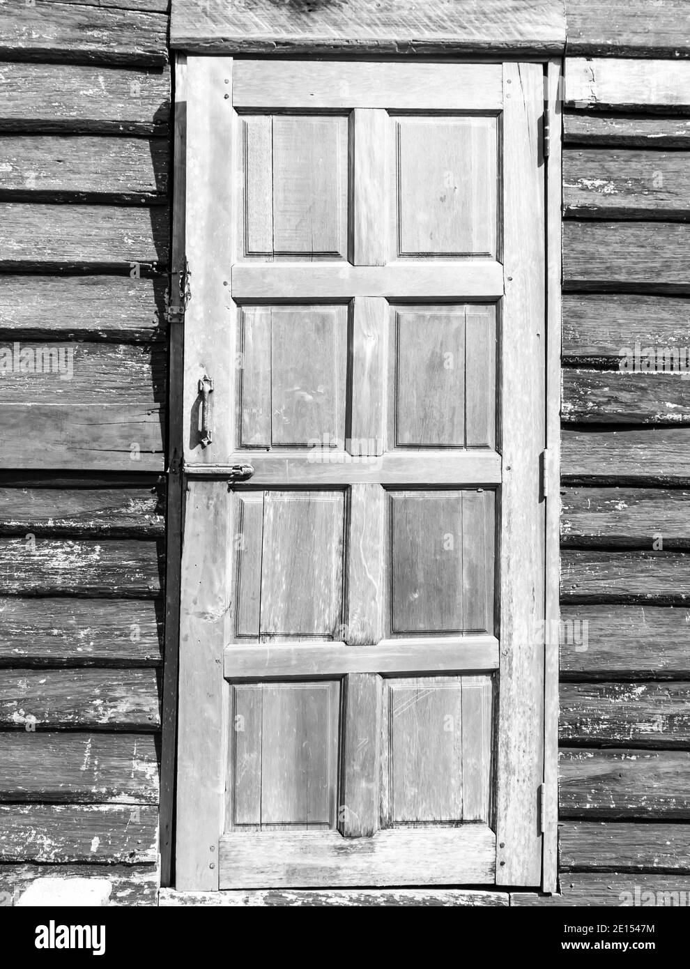 White painted wooden door on a light background washed wood Stock Photo