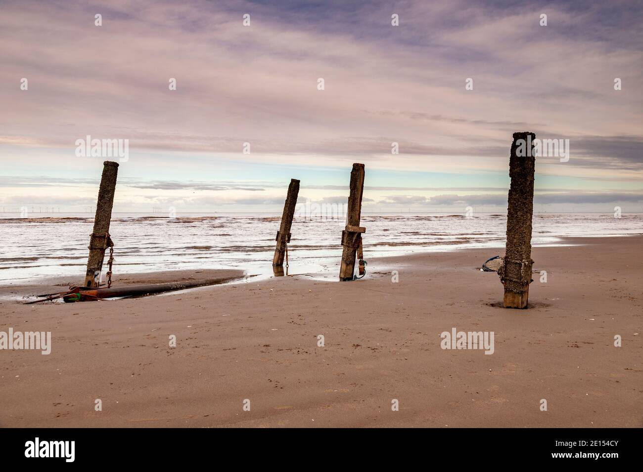Wooden groynes on Prestatyn Beach, North Wales Stock Photo