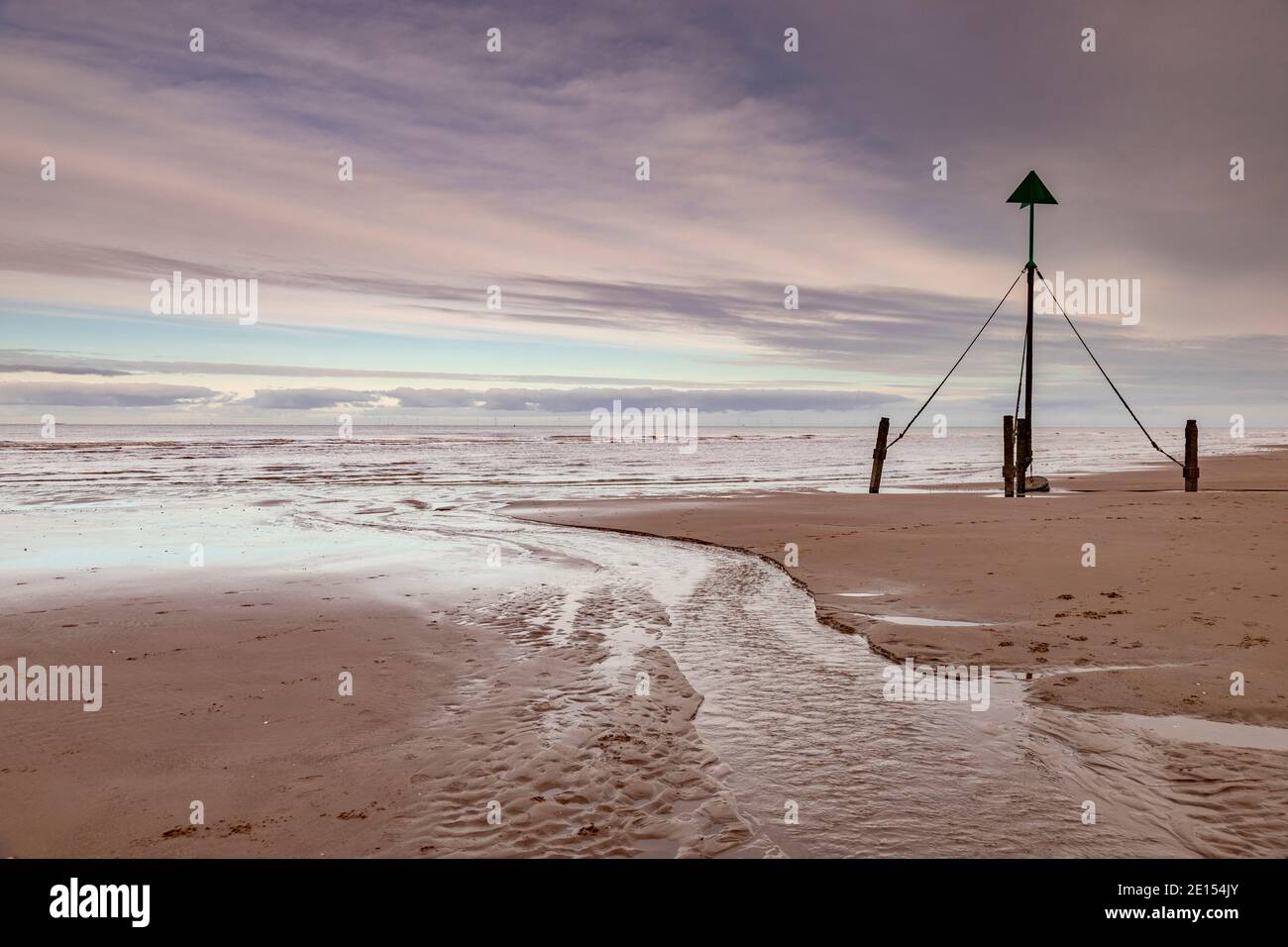 Marker post on Prestatyn Beach, North Wales Stock Photo