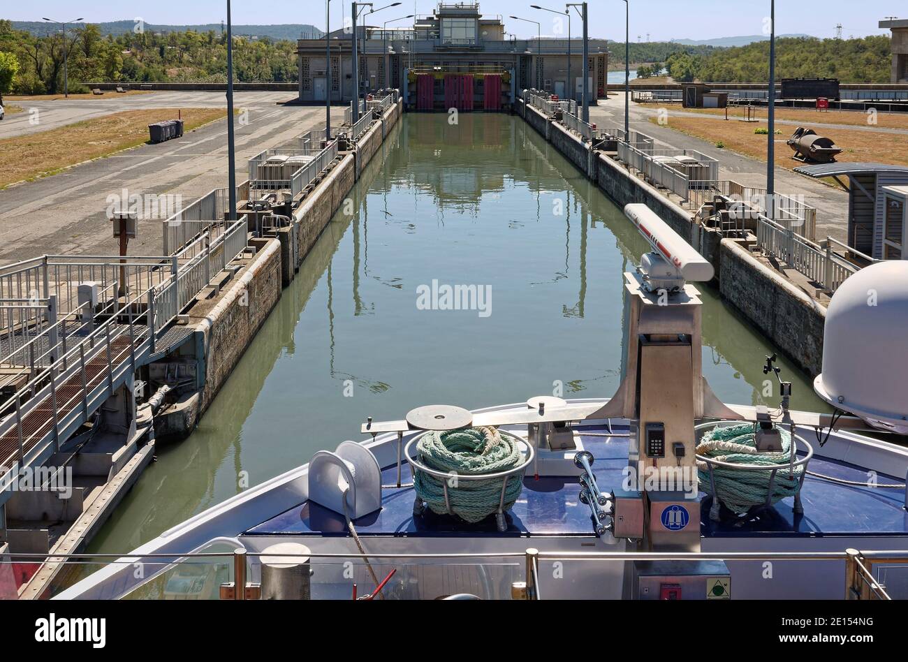 boat in Bollene Lock, Rhone River, 71 foot water level difference, engineering feat, travel, transport, narrow canal, Provence, France, summer Stock Photo