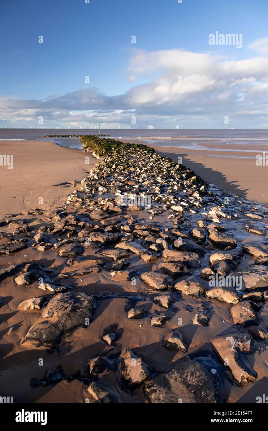 Breakwater and offshore turbines, Prestatyn Beach, North Wales Stock Photo