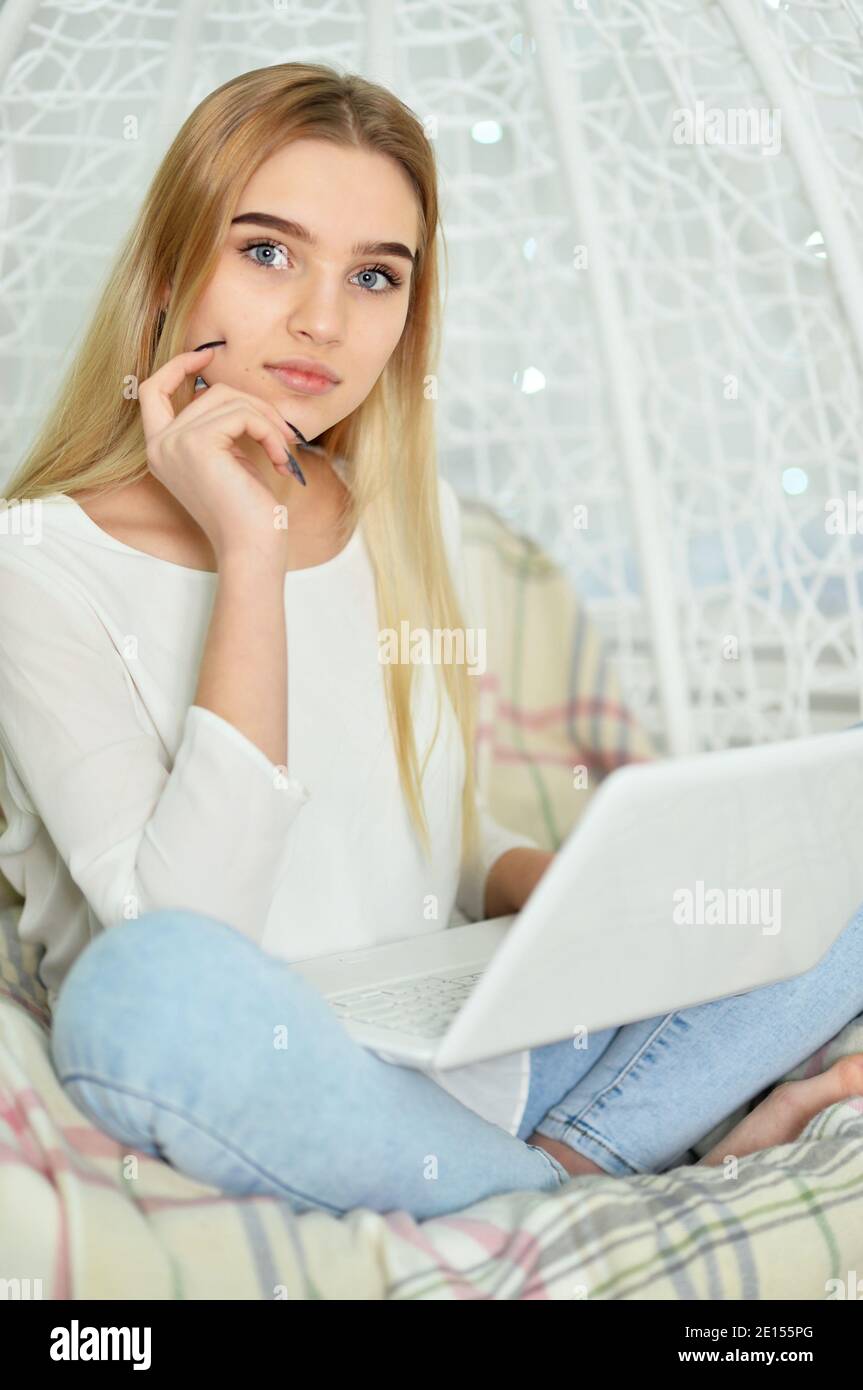 Portrait of beautiful cute girl using laptop Stock Photo - Alamy