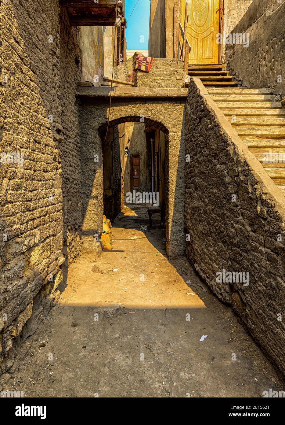 An old staircase next to a narrow alley in Coptic Cairo Stock Photo