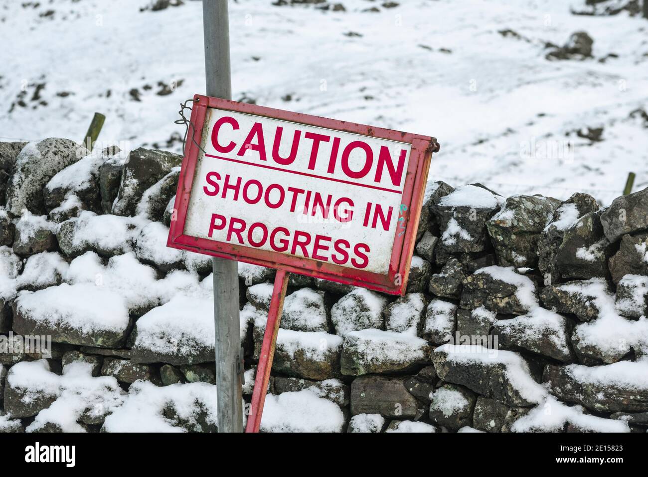 Sign warning Caution Shooting in Progress, near High Cup Nick, Dufton Stock Photo