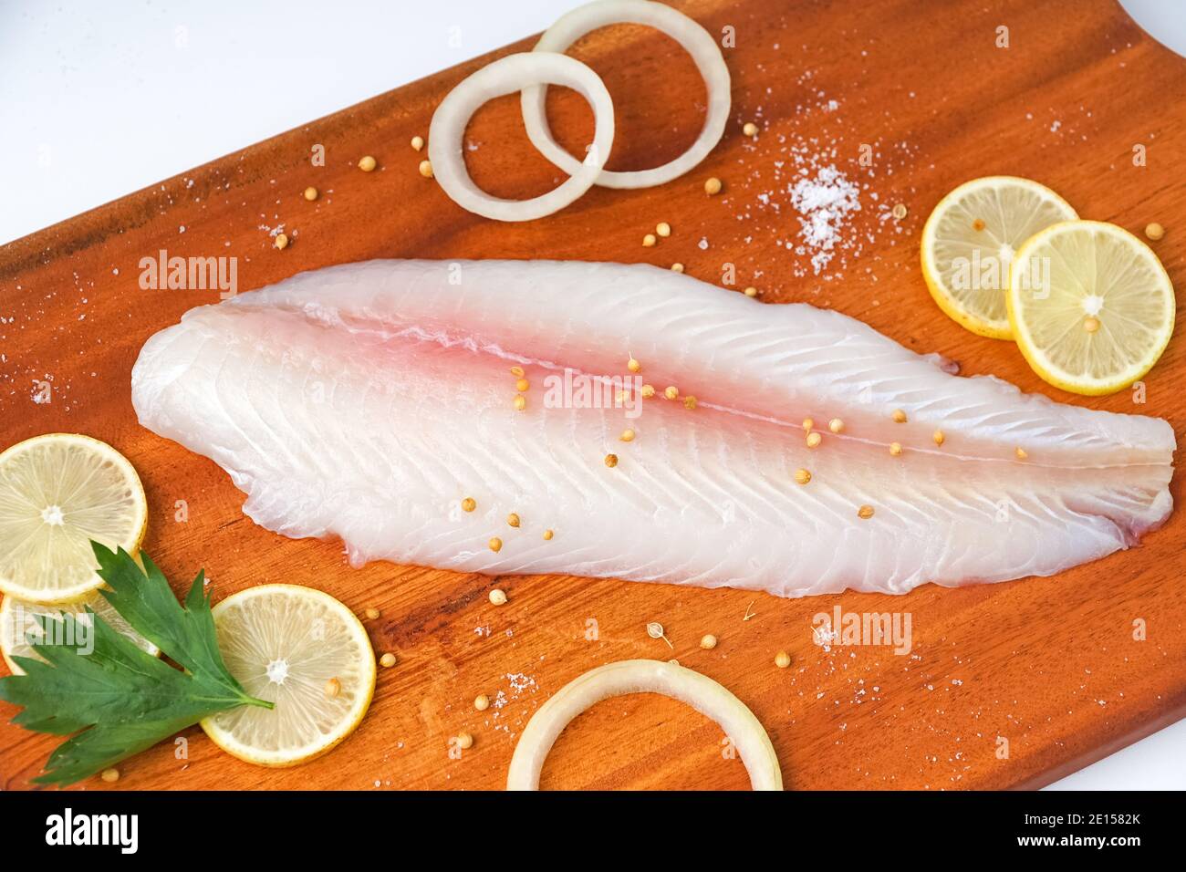 Doner Fish fresh fillet dory fish on wooden tray Stock Photo - Alamy