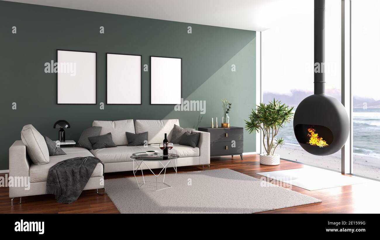 Modern loft style apartment with a stylish fireplace looking out to a beach through large floor-to-ceiling windows. Three picture frame mockups on the Stock Photo