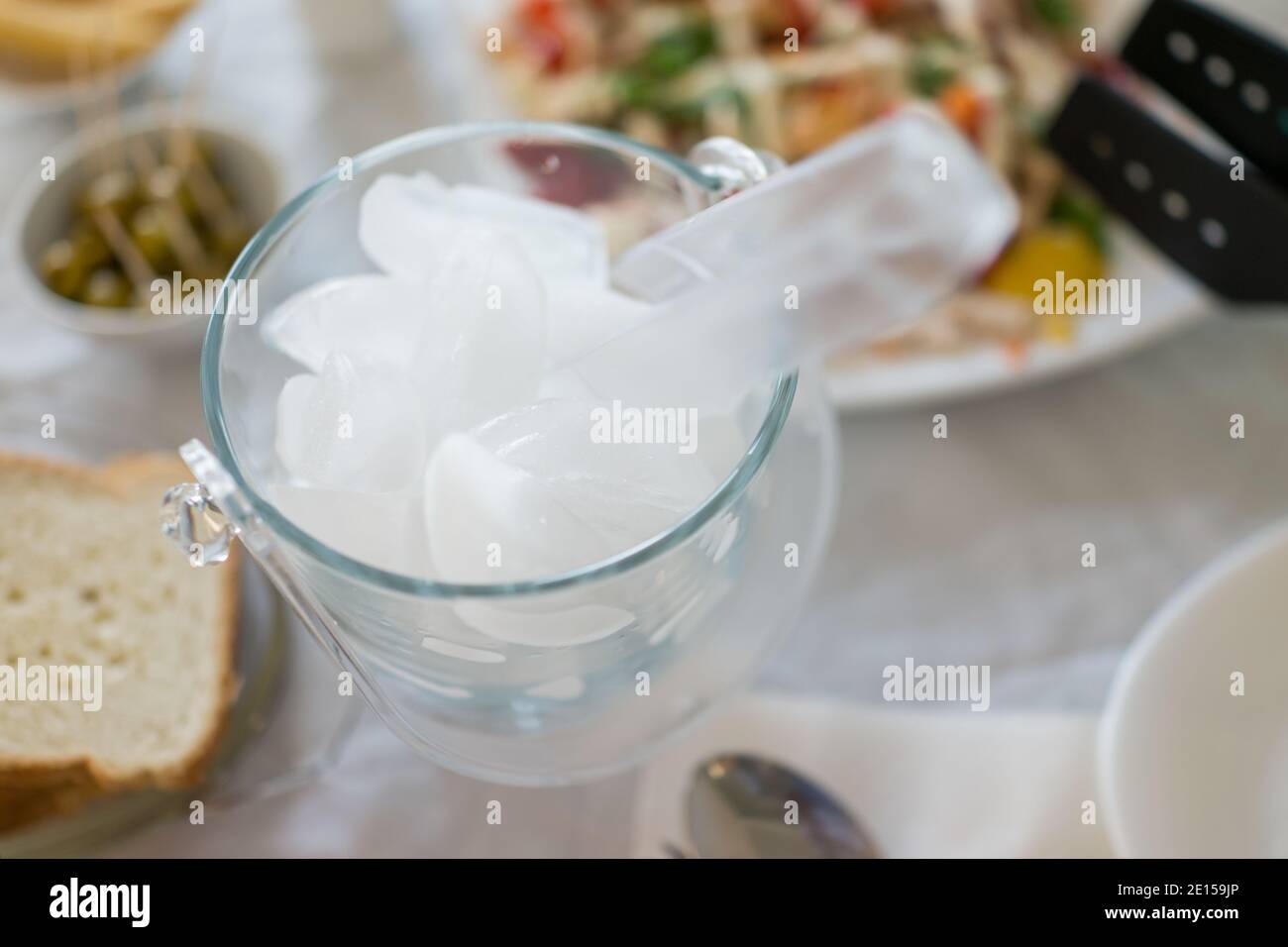 Ice bucket on kitchen table Stock Photo