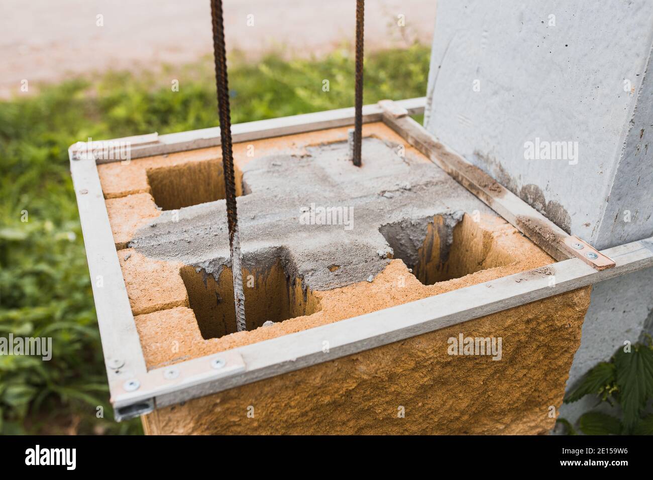 Construction of a stone pillar from concrete blocks supporting