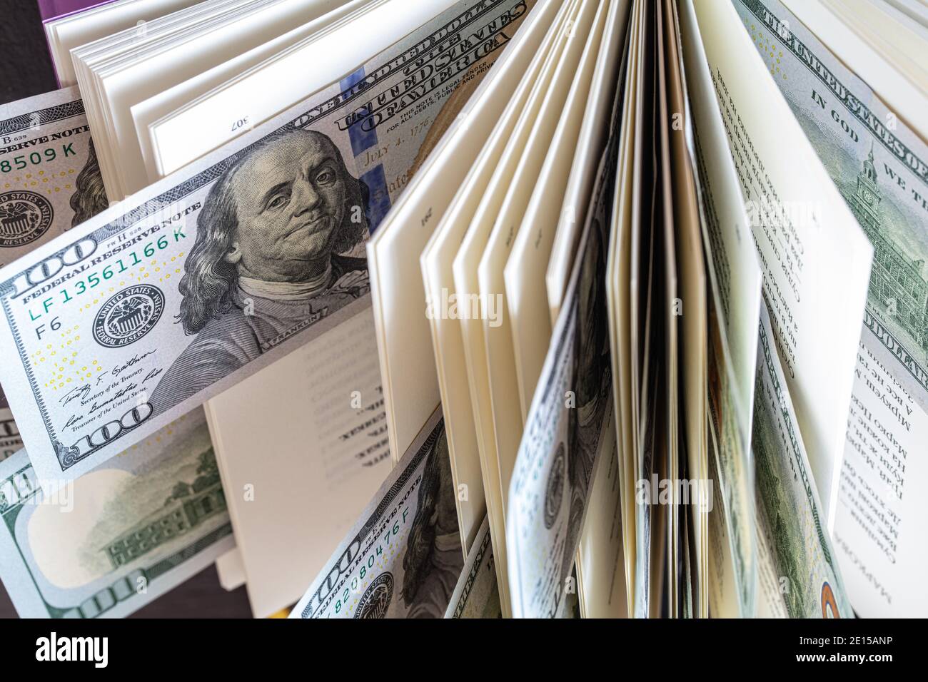dollar banknotes in open book Stock Photo