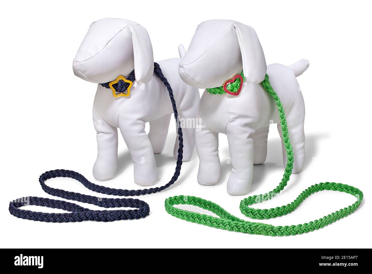Two dog leashes in black and green on plush dog mannequin with cute