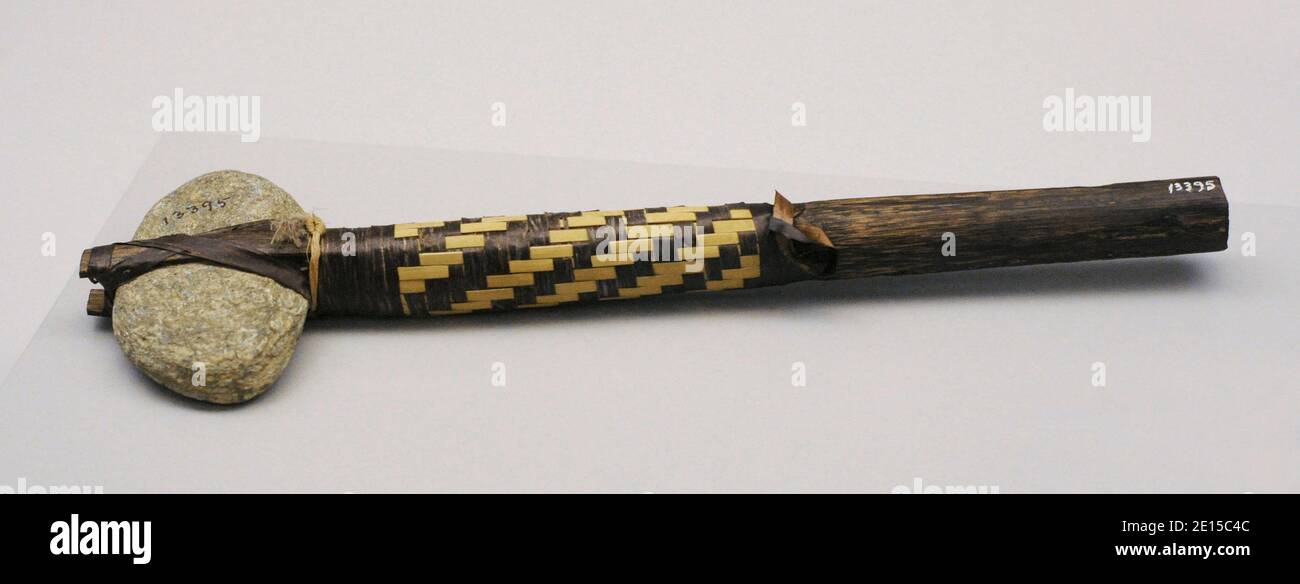 Head-breaker used as a blunt weapon. Wood, stone and plant fiber. Karaja indians. Bananal Island, Brazil. Museum of the Americas. Madrid, Spain. Stock Photo