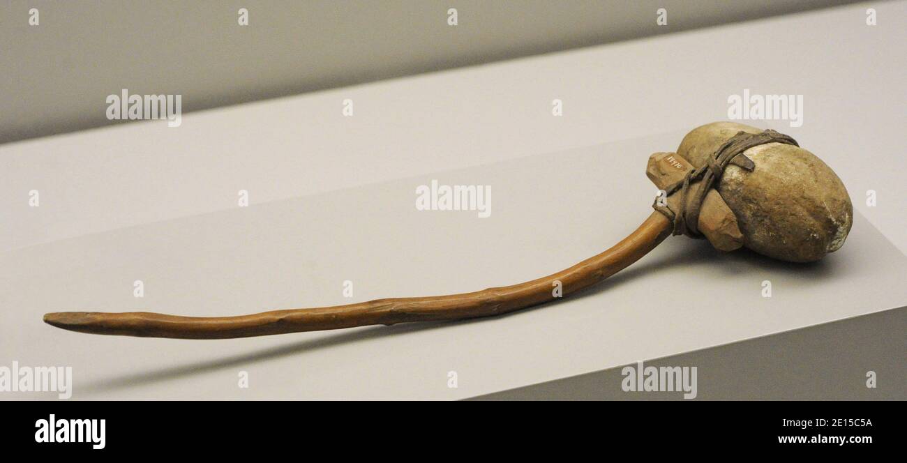 Head-breaker used as a blunt weapon. Wood, stone and plant fiber. Karaja indians. Bananal Island, Brazil. Museum of the Americas. Madrid, Spain. Stock Photo