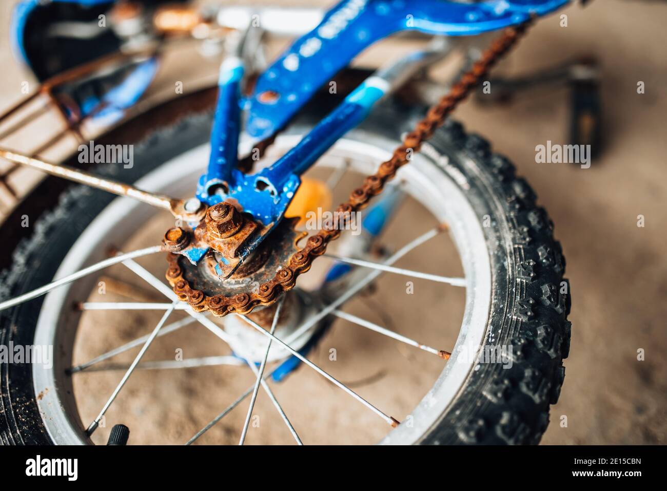 Old broken abandoned bike - rusty unmaintained without pedals Stock Photo