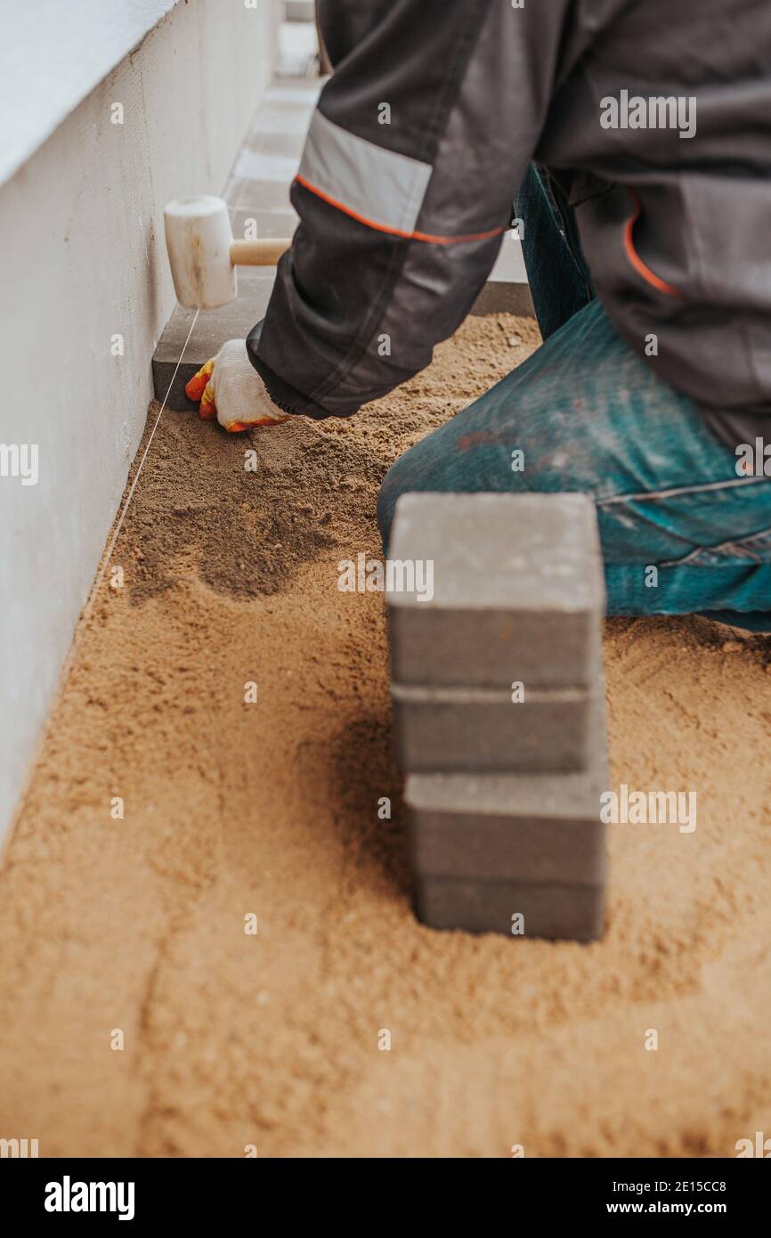 Bonding granite tiles to concrete subfloors outside the house porch